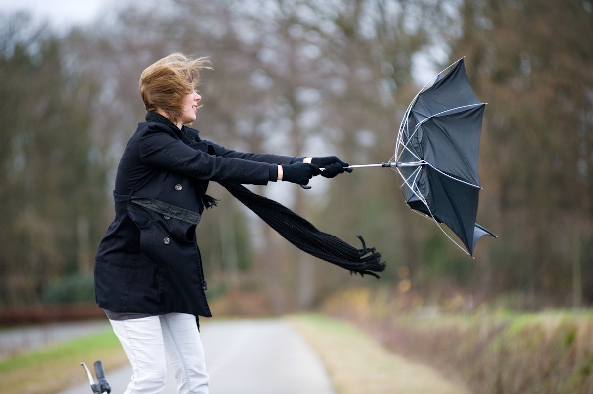 An umbrella breaking in strong winds